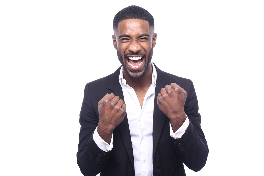 Excited Young Man Wearing a Business Suit 